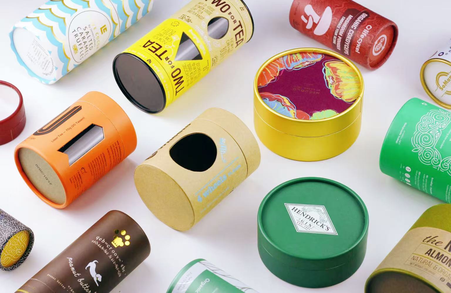 Custom paper tube packaging samples -- cylinder boxes in various sizes and finishes